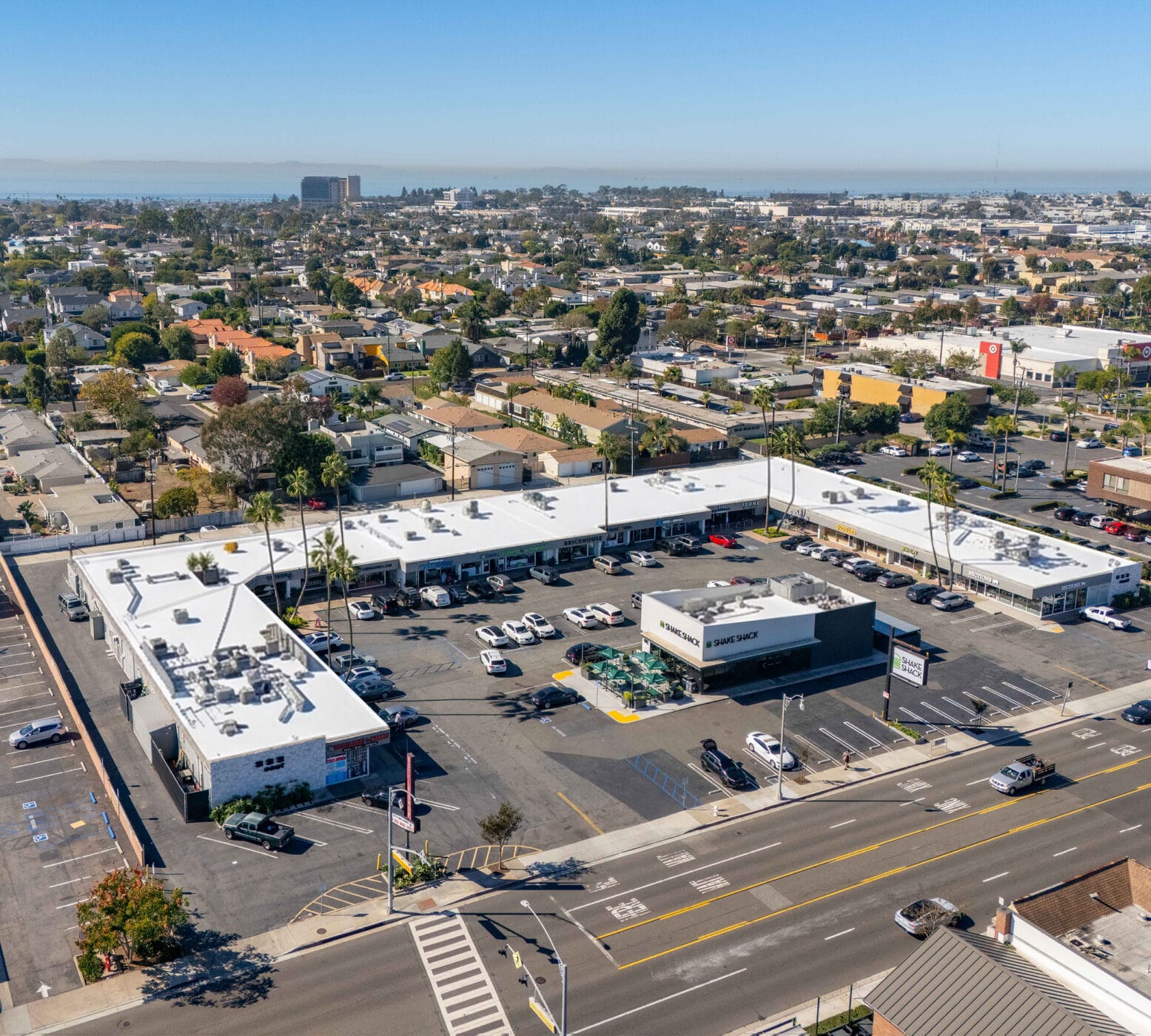 Aerial image of Seventeen Village from 17th Street with the Target shopping center to the right and Newport Beach in the far distance.