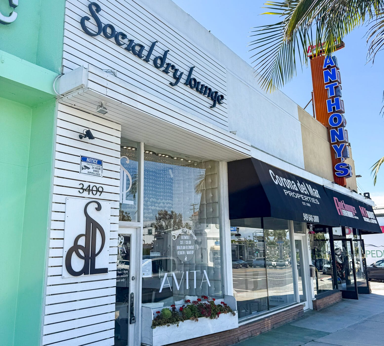 Facade at 3409 E Coast Hwy. To the right, Corona Del Mar Properties and Anthony's Leatherworks.