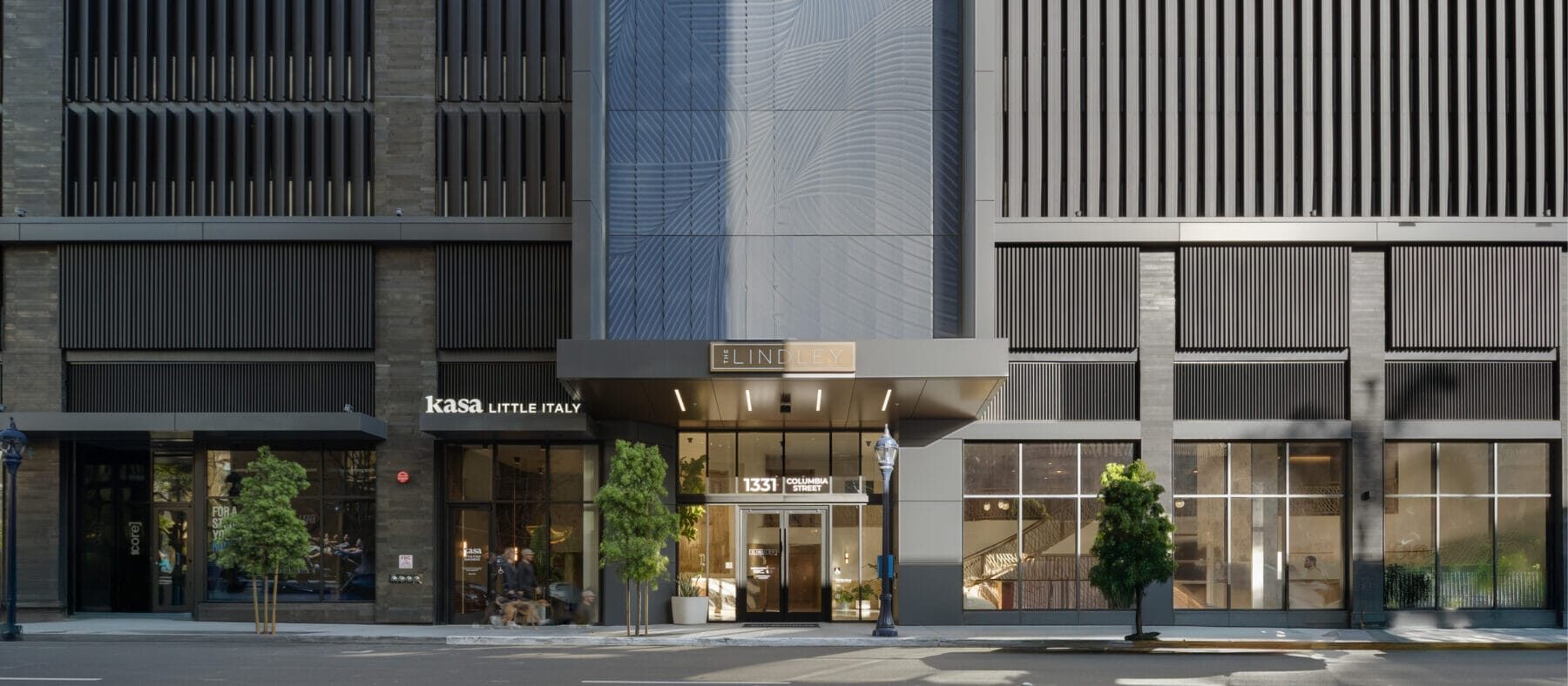 Front entrance to The Lindley at 1331 Columbia St as seen from the street with Kasa Little Italy restaurant to the left of the main doors.