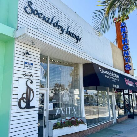 Facade at 3409 E Coast Hwy. To the right, Corona Del Mar Properties and Anthony's Leatherworks.