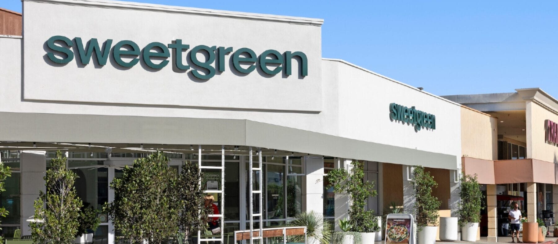 Row of stores in sunny bright blue sky