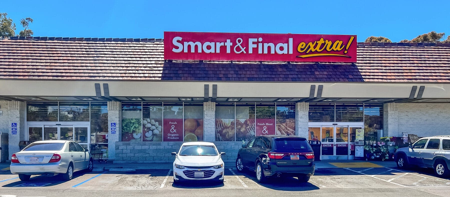 Strip mall, single story building with red sign