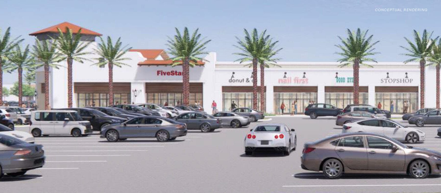 White single story buildings for retail use with palm trees in front