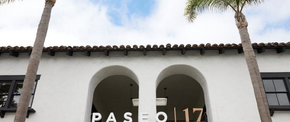 Paseo 17 sign above an arched entrance.