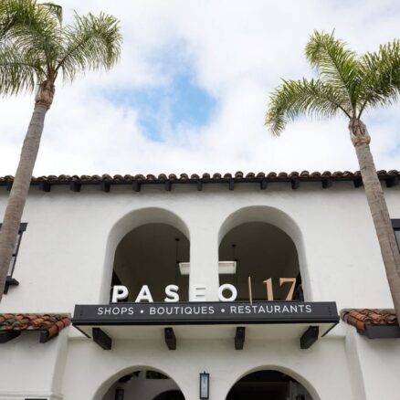 Paseo 17 sign above an arched entrance.