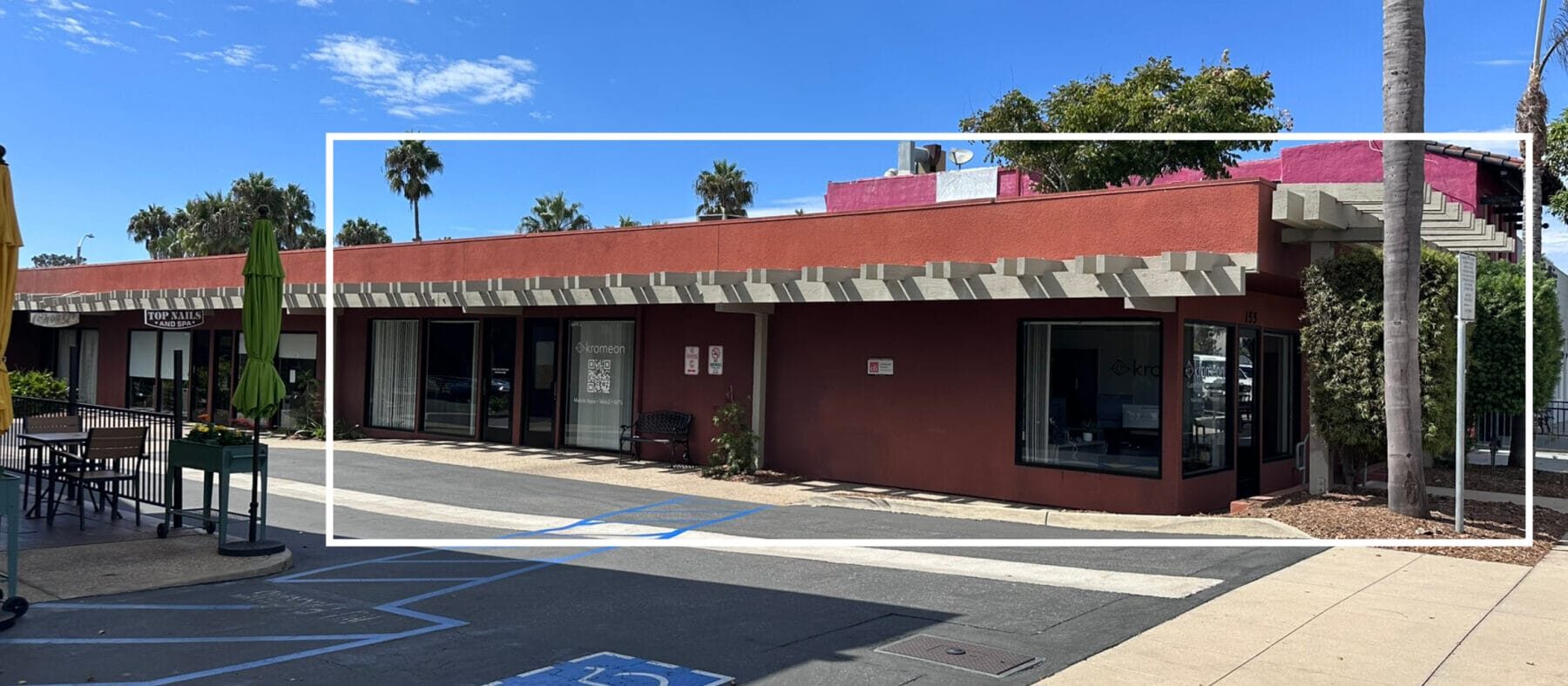 Side view of a single story building painted red