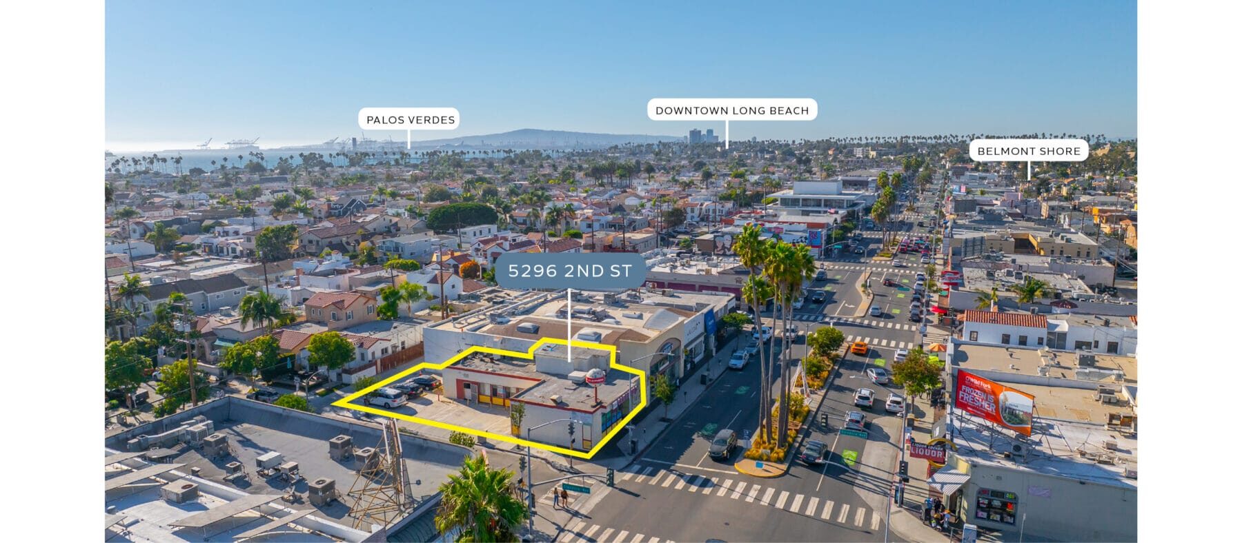 Aerial view of a building outlined in yellow with blue skies