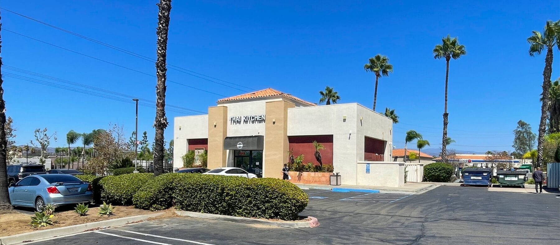 The freestanding building for lease at 1101 W Valley Pkwy viewed across the parking lot.